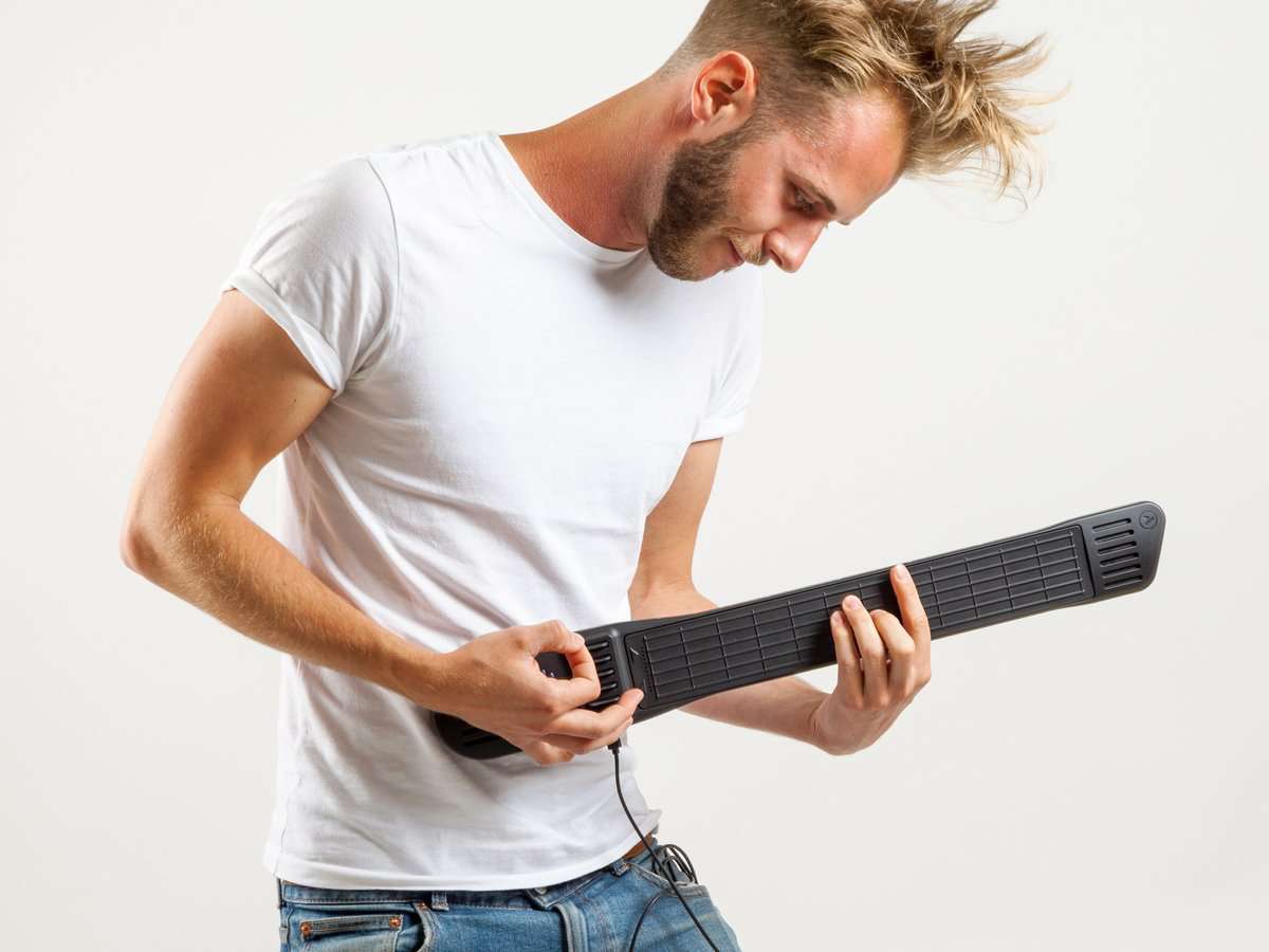 Blond Man Playing Black INSTRUMENT 1 by Artiphon